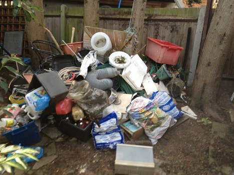 Workers safely clearing builders waste in Sanderstead
